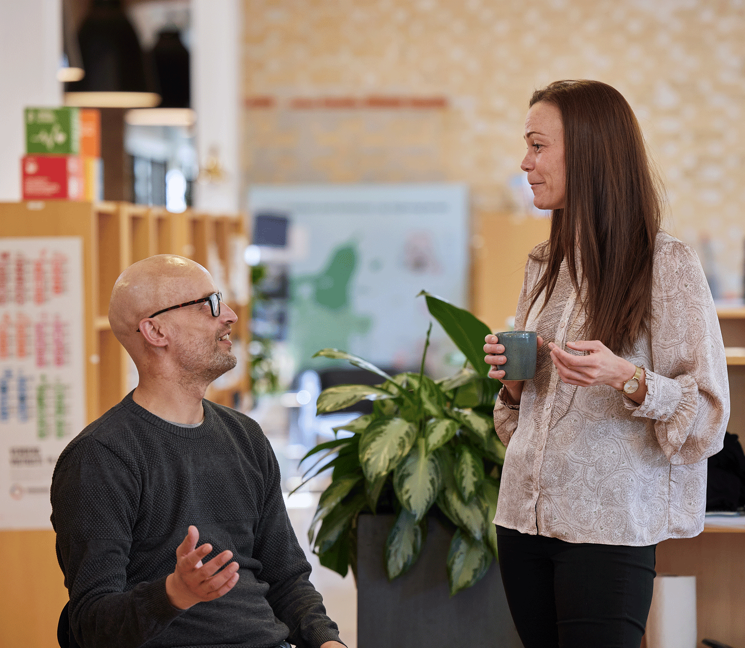 A man a woman talking to each other